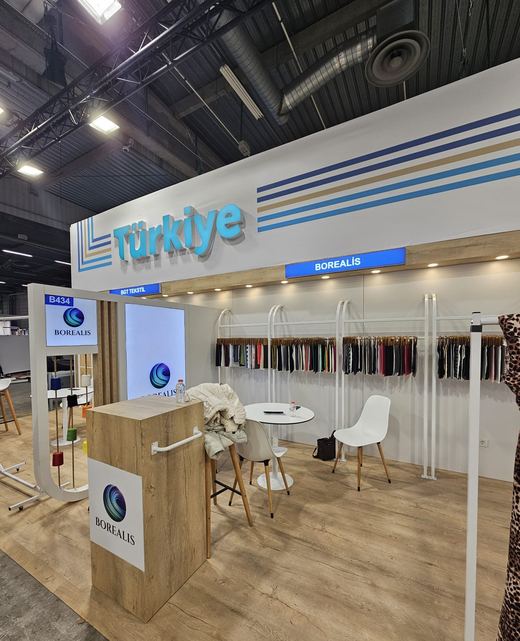 Borealis booth, angled view with fabric racks