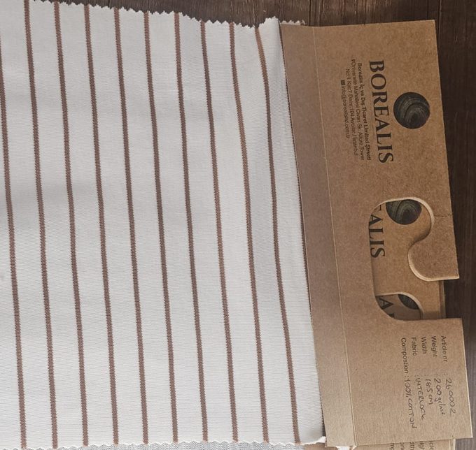 Real Borealis fabric spec tags — GSM, composition and width noted on every sample